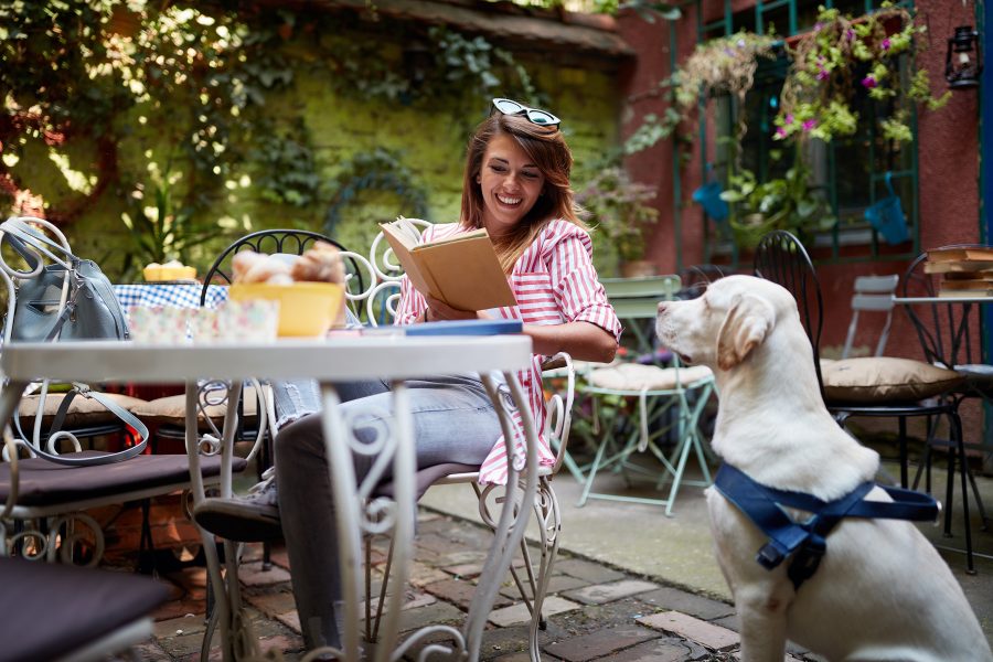 a woman and her dog at a Chestertown restaurant