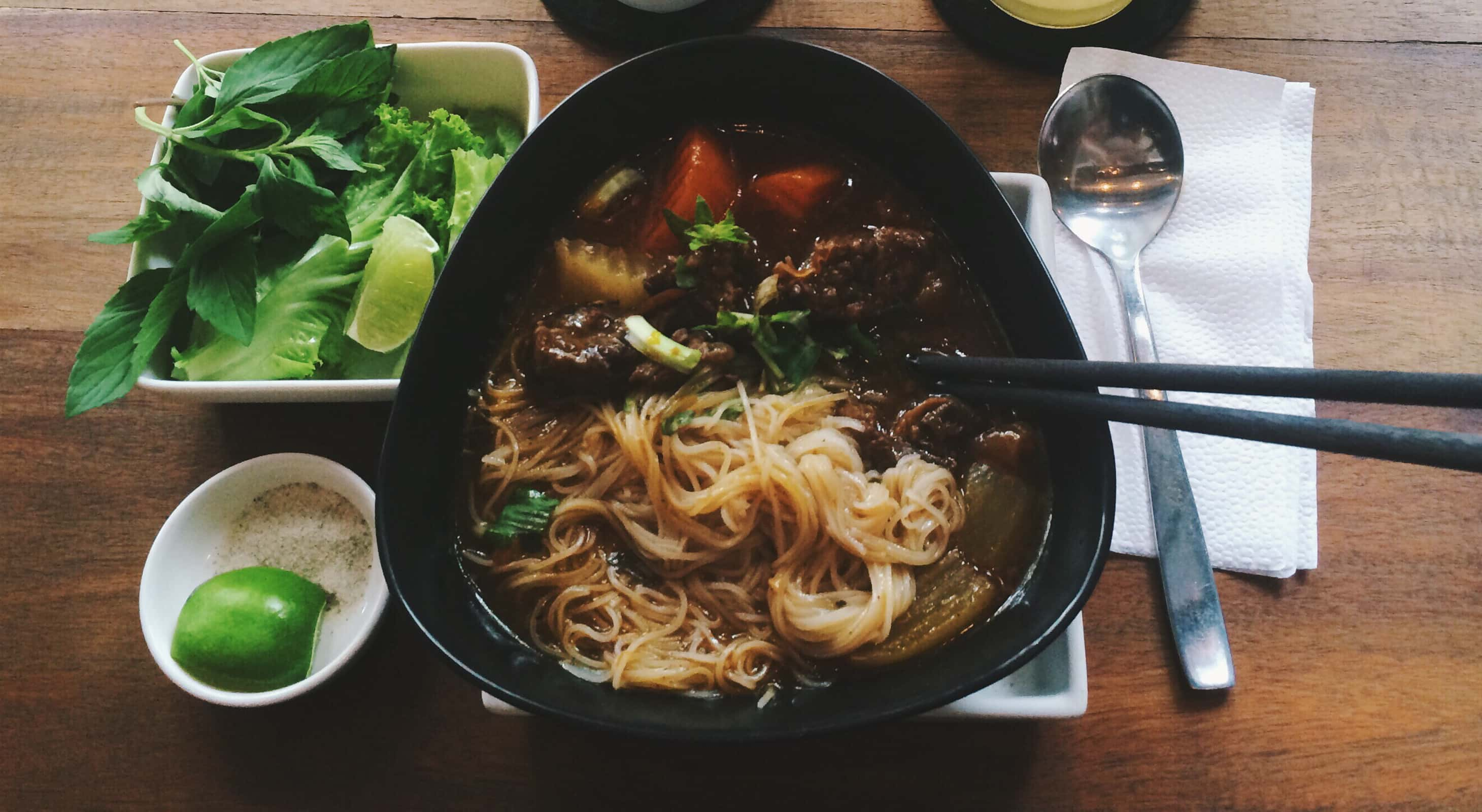 Vietnamese beef pho served with garnishes