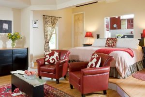 Cottage room with bed and sitting area