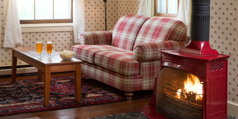 Cozy up next to the wood burning stove in the Red Room, a perfect winter getaway