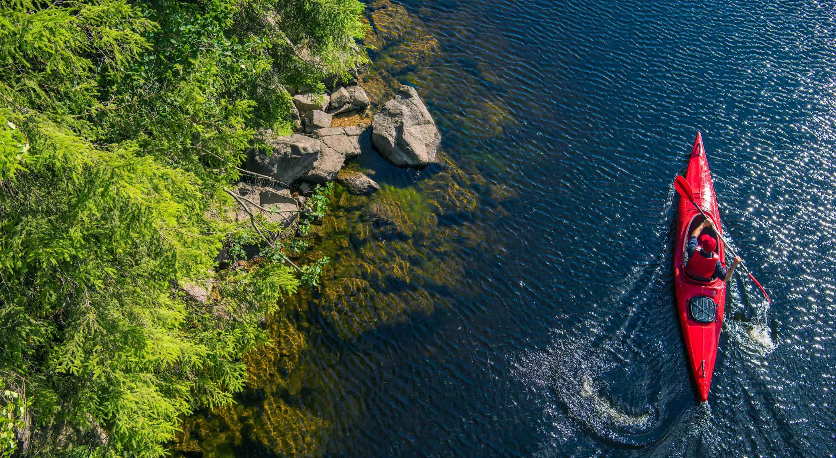 View of kayaker on river from above