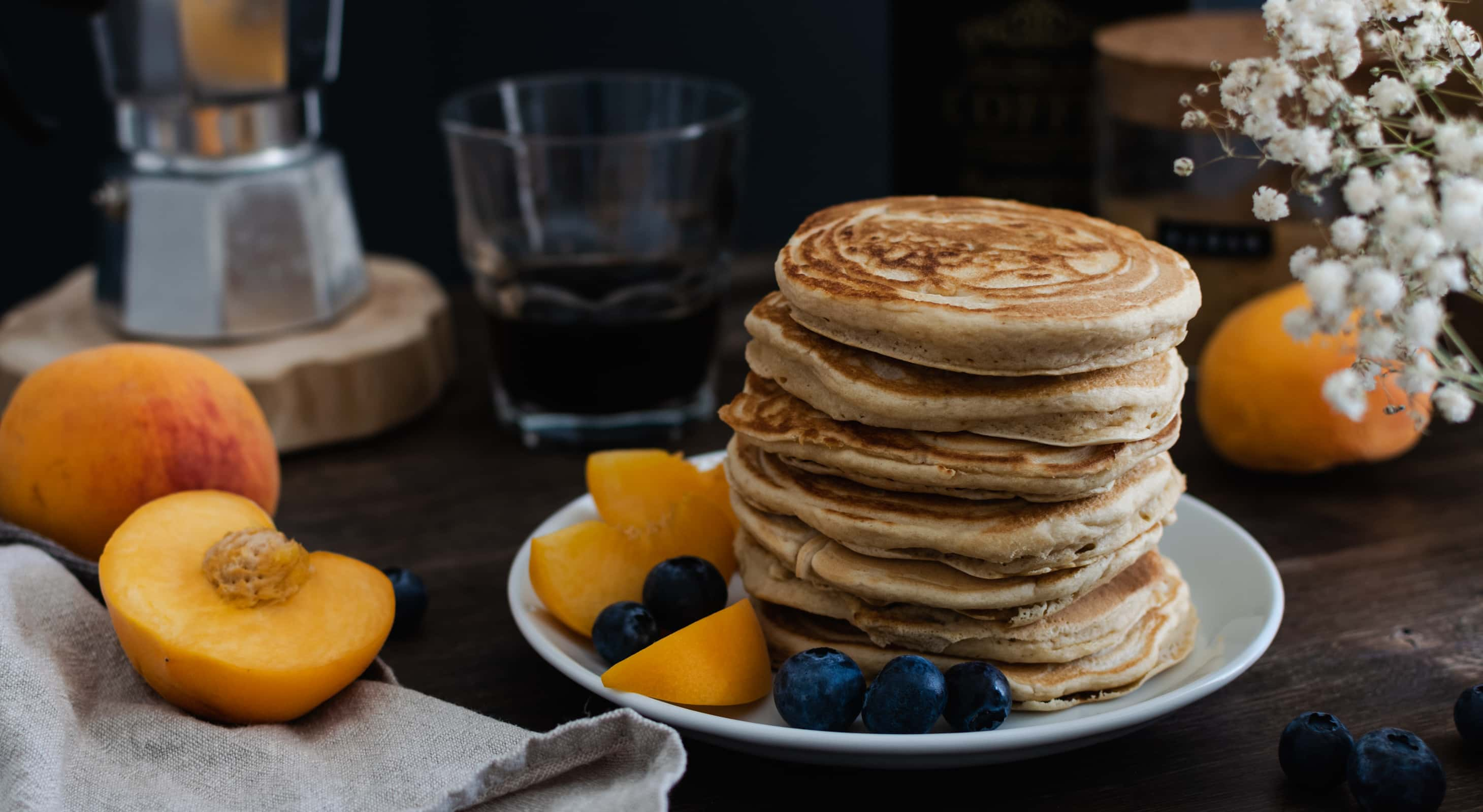 Peach pancakes served with fresh fruit