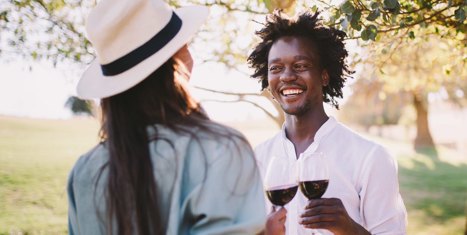 Couple drinking wine and having fun in the outdoors